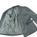 Vintage Swiss army wool jacket in grey, military surplus, with detailed pockets and emblem patches inside and out.