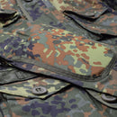 Close-up of Mil-Tec Flecktarn camo RipStop smock with multiple pockets and durable polycotton fabric detail.