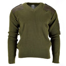 Olive green Italian army pullover with v-neck, ribbed wool knit, reinforced shoulders, and pen pocket on sleeve.