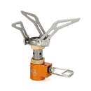 Compact lightweight titanium foldable camping stove burner with orange base for hiking and outdoor use