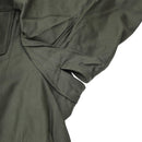 Close-up of olive green genuine Belgian army M64 field jacket sleeve with reinforced elbow and pocket details