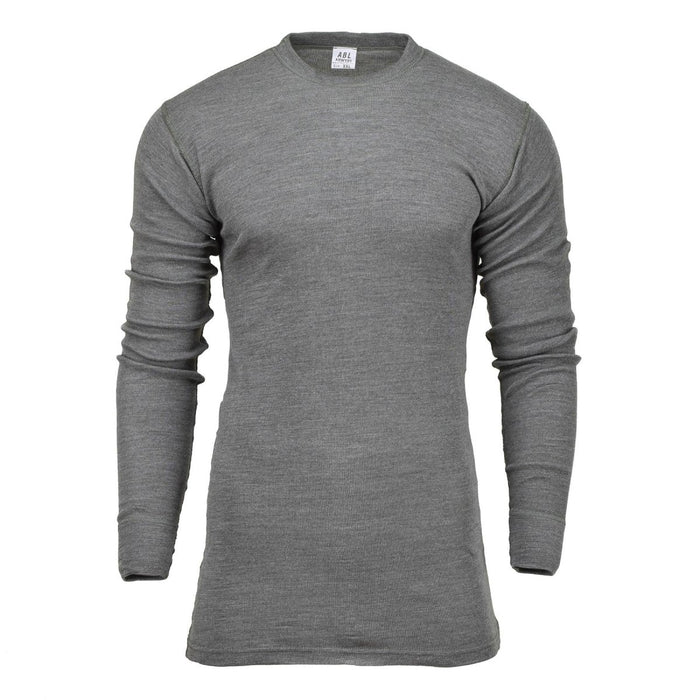 Camiseta interior térmica auténtica de color gris militar belga, de manga larga, confeccionada en tejido de aramida ignífugo y cuello redondo.