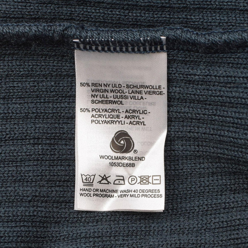 Clothing care label showing 50% virgin wool 50% polyacryl content and washing instructions for Dutch military sweater