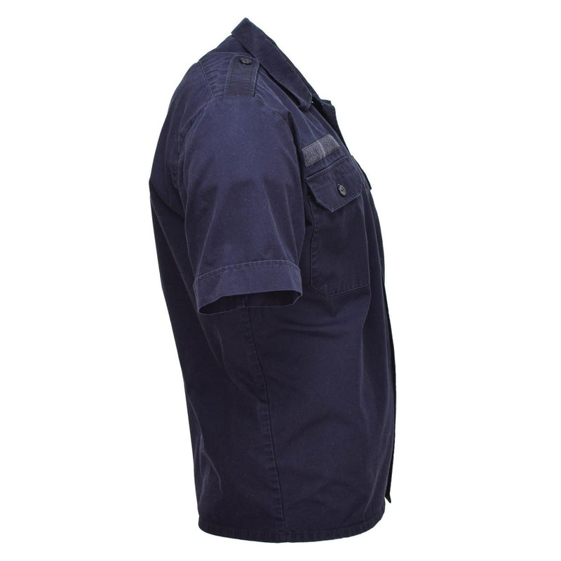 Side view of solid blue Dutch military short-sleeve buttoned shirt with chest pocket and shoulder epaulets