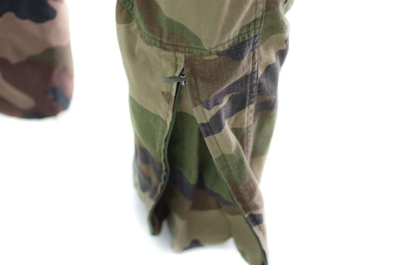 Close-up of French army combat pants in CCE camouflage ripstop fabric with zipper detail on leg pocket