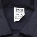 Close-up of a genuine French navy thermostable marine jumpsuit label showing size 100C and care instructions