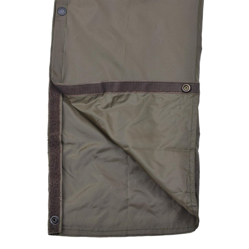 Thermal lined waterproof olive green Italian military rain pants with hook and loop side leg openings.