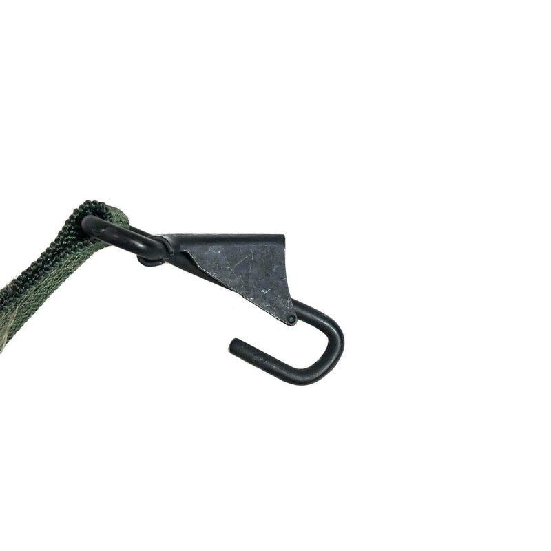 Close-up of a black metal hook attached to green genuine US Army LC-2 belt suspenders webbing.