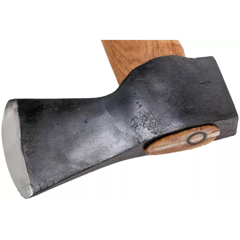 Close-up of sharpened carbon steel axe head with long hickory handle for outdoor wood cutting tasks