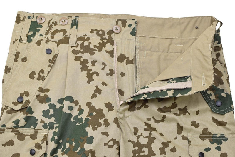 Close-up of Leo Kohler Commando tactical field pants in Tropentarn camo with multiple pockets and reinforced stitching