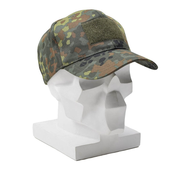 Military flecktarn camouflage baseball cap with peaked visor and adjustable strap on a white mannequin head.
