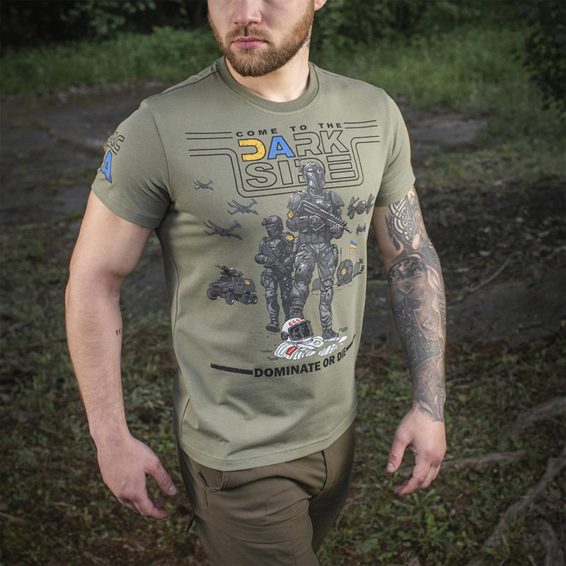 Man wearing olive green M-TAC military style t-shirt with Ukrainian flag and graphic design outdoors