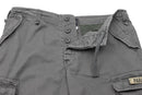 Close-up of Mil-Tec military-style gray cargo shorts with button fly, belt loops, and multiple pockets visible.