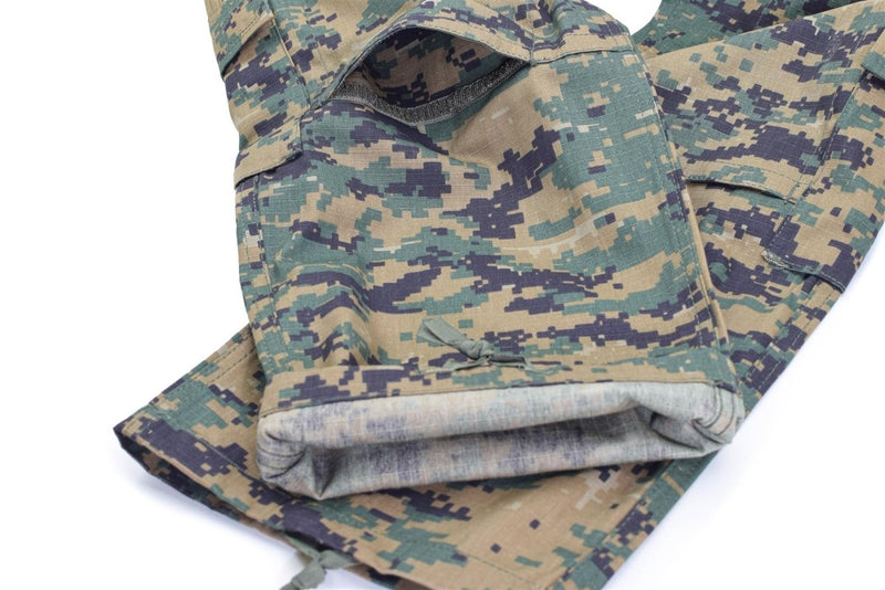 Folded Mil-Tec U.S. Army style digital woodland camo pants with cargo pockets and ripstop fabric detail.