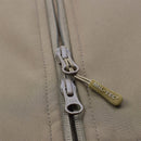 Close-up of MIL-TEC Military style SCU14 jacket zipper in dark coyote with branded pull tab on soft shell fabric