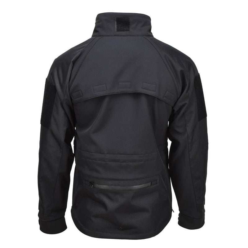 Back view of MIL-TEC black softshell windproof and water-resistant activewear jacket with vented back panel and zippered pockets.