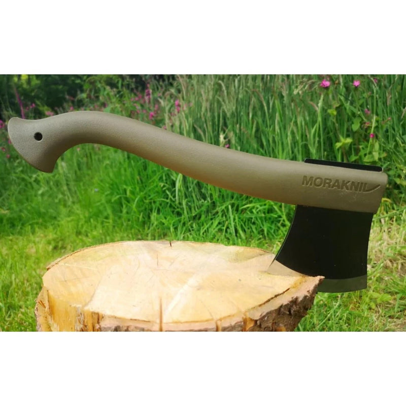 MORAKNIV Lightweight axe with ergonomic handle and black coated boron steel blade resting on a tree stump outdoors