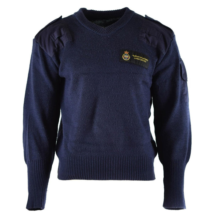 Jersey comando de lana azul con cuello en V, original del Servicio de Defensa Británico, hombros reforzados y bolsillo de parche.