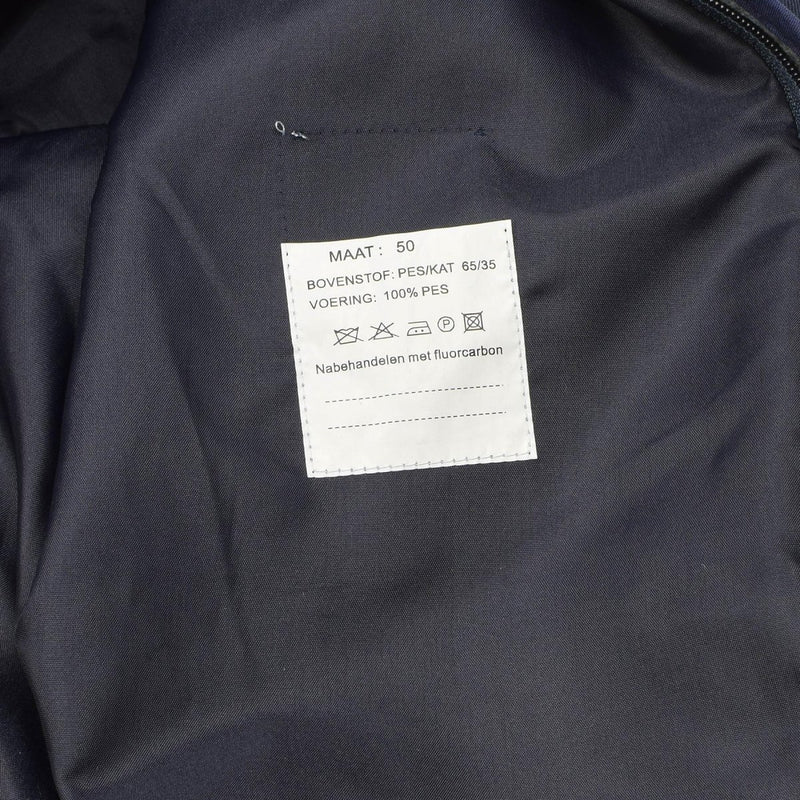 Close-up of the sewn-in care label inside the Original Dutch Military men's blue raincoat with quilted liner.