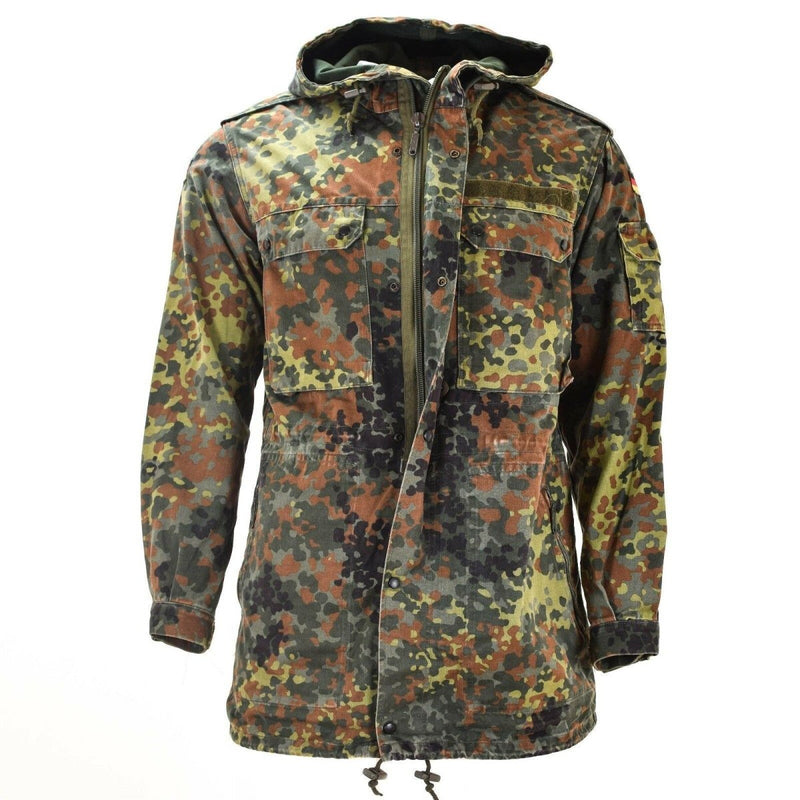 Original German army Flecktarn camo field jacket parka with hood, liner, adjustable cuffs, multiple pockets, and military detailing.