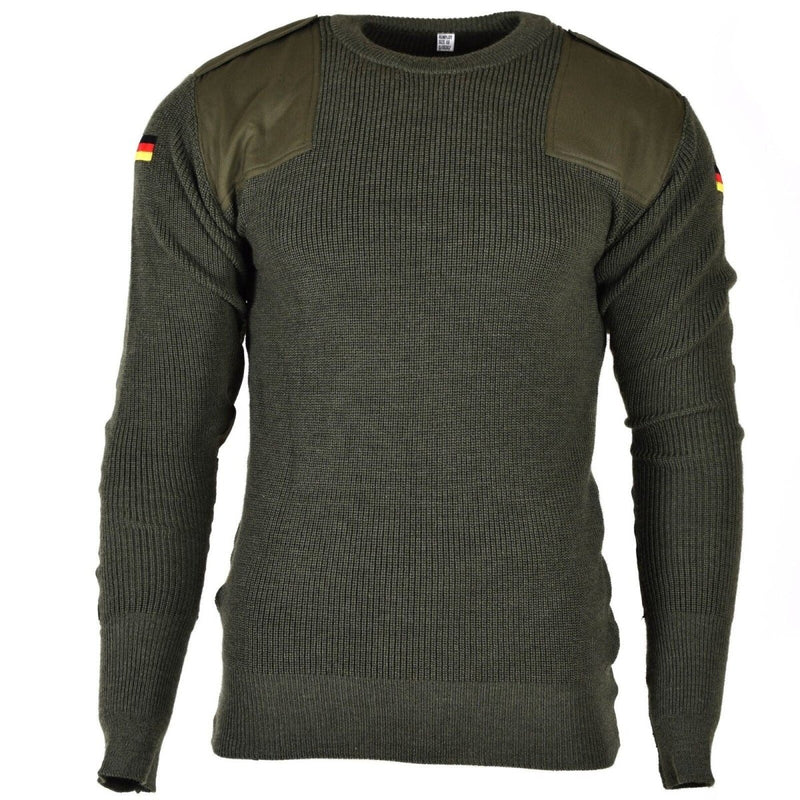 Original German army wool pullover jumper in olive green with reinforced shoulders and German flag patches on sleeves