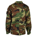 Back view of original Italy military combat jacket in lightweight woodland camo with buttoned cuffs and multiple pockets.