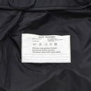 Close-up of the black military rain jacket’s interior label showing fabric and care instructions in Dutch.