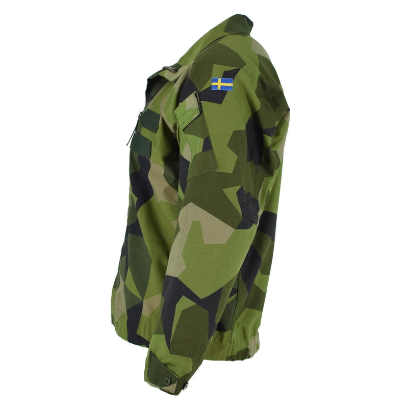 Original Swedish army M90 splinter camouflage combat jacket with adjustable cuffs and Swedish flag patch on sleeve.