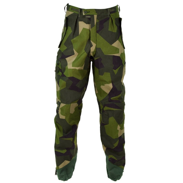 Original Swedish Army M90 pants in splinter camouflage with reinforced knees, ankle zips, and secure pocket closures for durability.