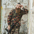 Man wearing Original Swiss army Alpenflage camo combat field jacket with tactical gear in urban setting
