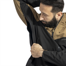 Man wearing black and brown Pentagon Monlite WP Softshell Jacket showing underarm ventilation zipper detail