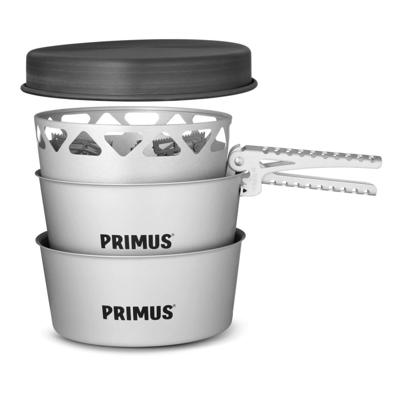 Compact Primus Essential Stove Set with 1.3L pot, pan, and lightweight handle for camping and hiking cooking needs