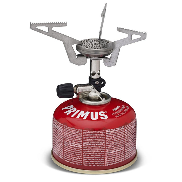 Estufa de camping de bolsillo plegable y liviana Primus Express unida a un recipiente de gas rojo para uso en exteriores