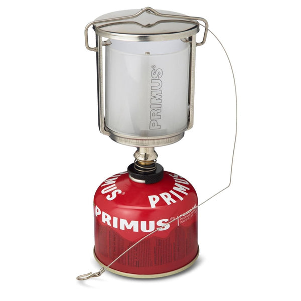 Primus Mimer Duo stainless steel gas lantern with frosted glass globe and red fuel canister for camping light