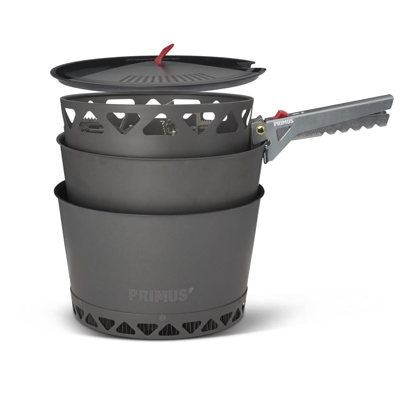Primus PrimeTech 2.3L camping cookware set with pots, lid, heat exchanger, and pot gripper for outdoor cooking.