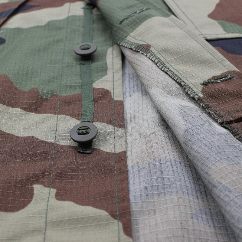 Close-up of TACGEAR French military style commando jacket with CCE camo pattern and durable ripstop fabric buttons.