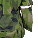 Close-up of TACGEAR military style ripstop commando jacket sleeve with splinter camo and a small white item in pocket